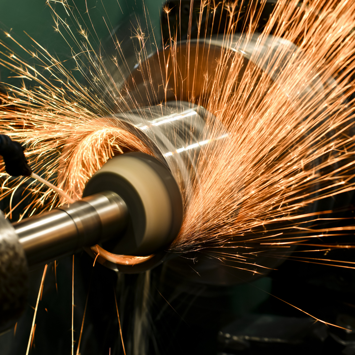 Grinding metal part for material removal